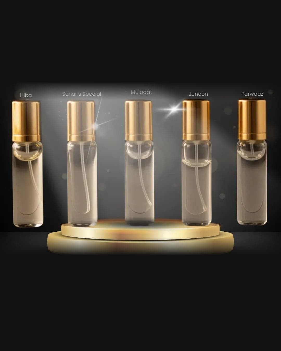 The Complete Tester Set: five slim 5ml glass spray vials with gold caps, labelled Hiba, Suhail's Special, Mulaqat, Junoon and Parwaaz, standing on a gold podium under a spotlight against a dark backdrop.